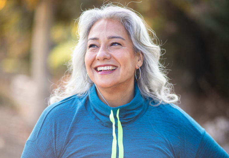About Adeo: this is a picture of a woman who is smiling.